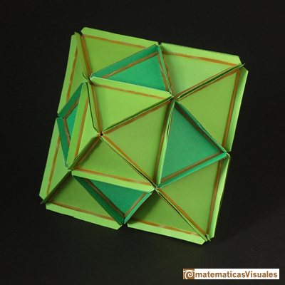 Volume of a cuboctahedron: a cuboctahedron and a octahedron made with rubber bands and paper | matematicasvisuales